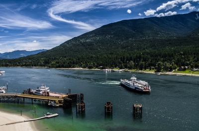 Aerial of the Kootenay Lake Ferry coming into the Balfour Ferry Terminal.