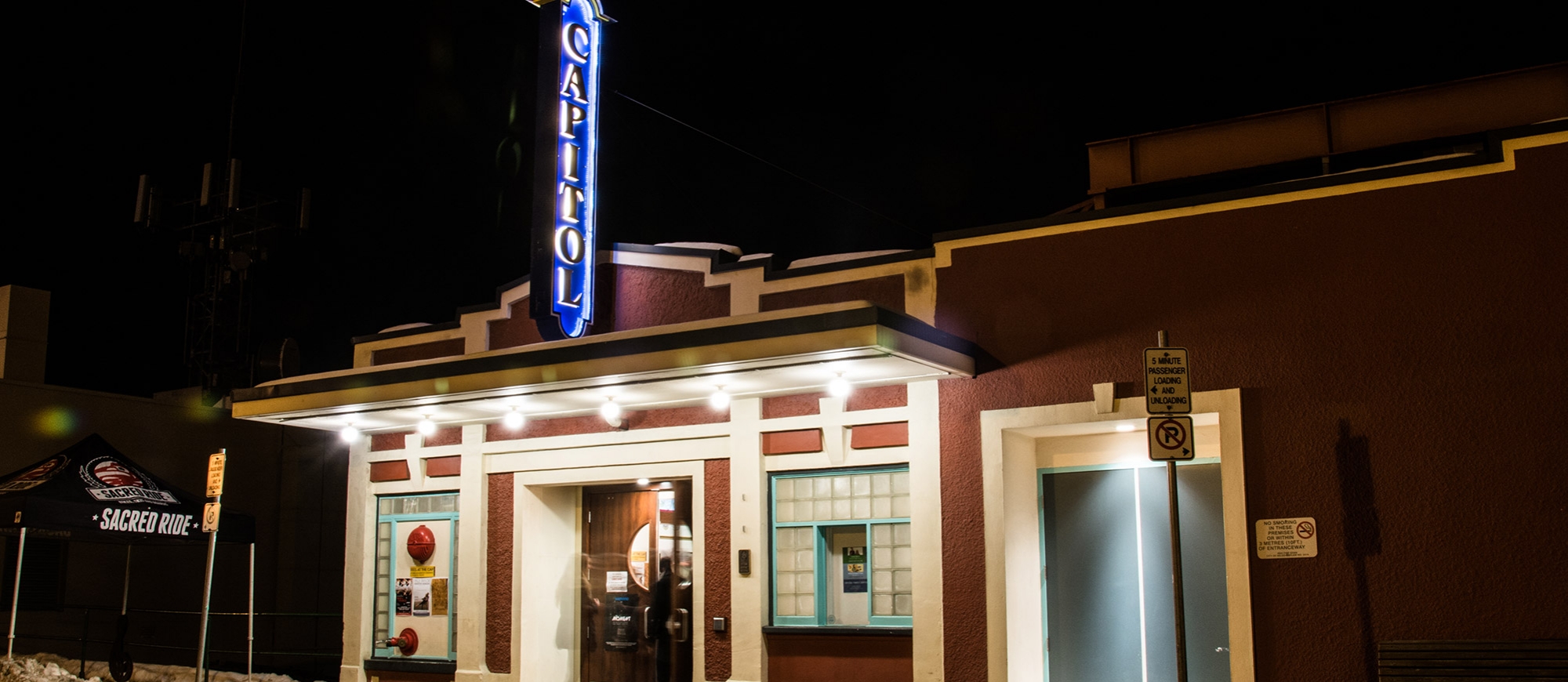 Capitol Theatre lit up at night in Nelson, BC