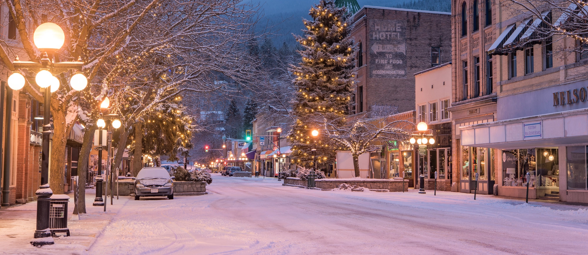 Nelson BC in the evening light covered with snow and lit up by Christmas Lights