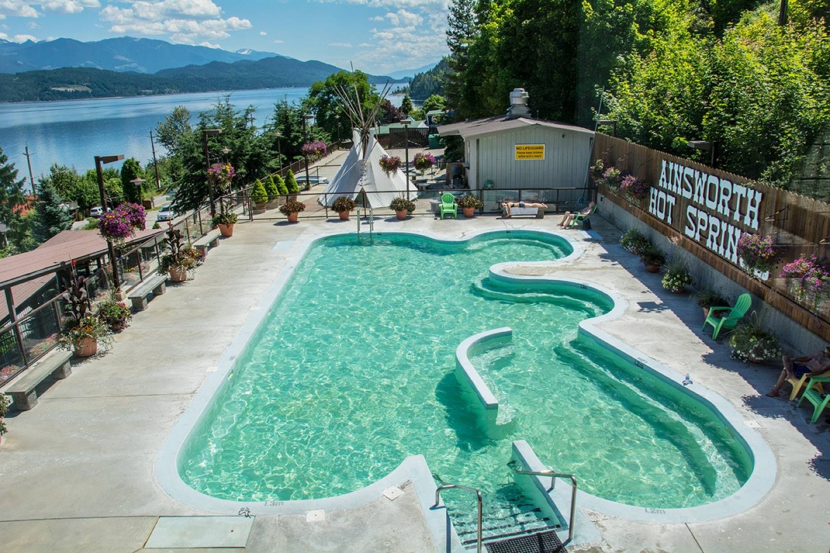 Ainsworth Hot Springs Resort pool on a sunny day. 