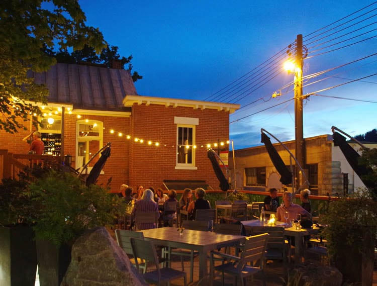 The patio lit up in the evening at Pitchfork Eatery.