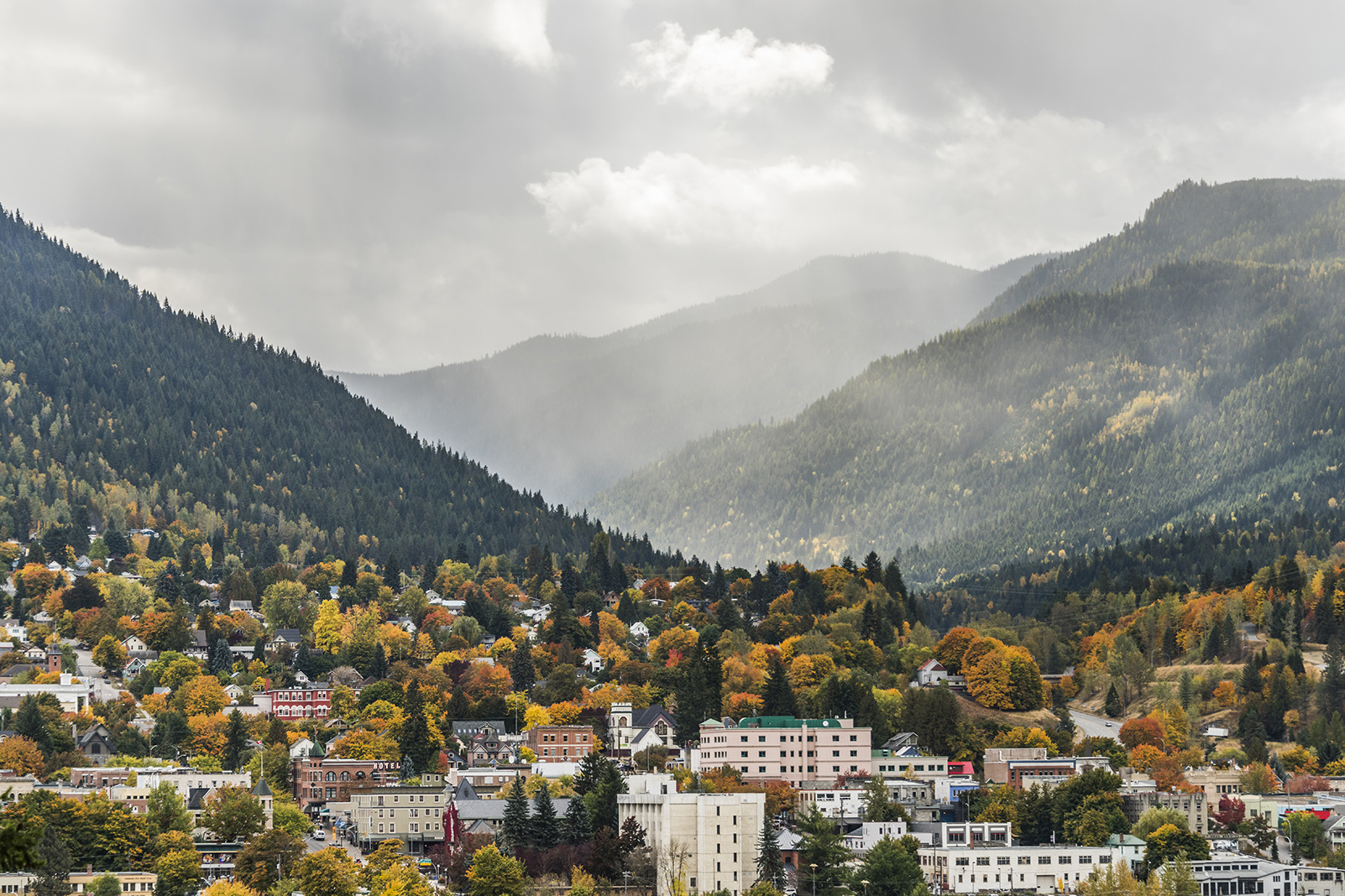 Nelson BC with fall colours and a rain cloud in the sky