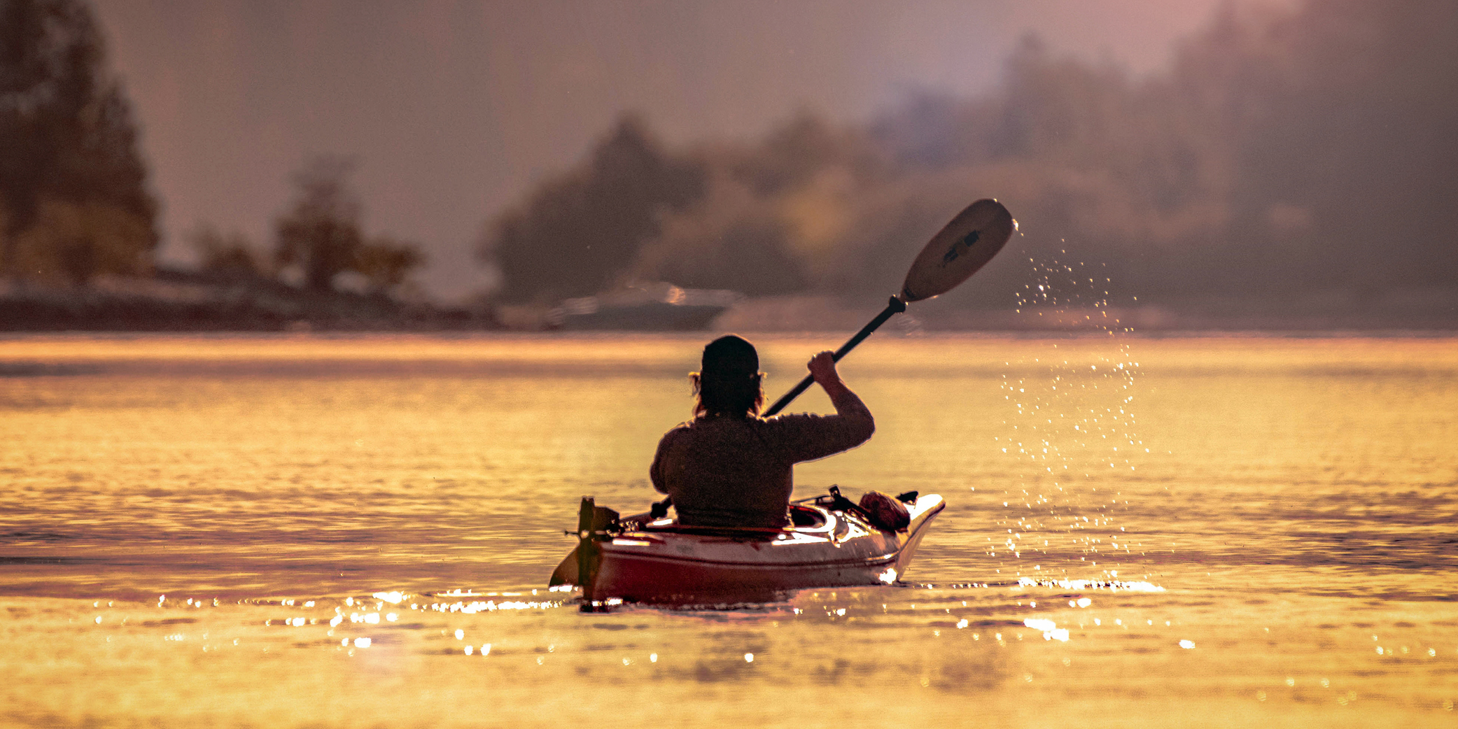 Person paddling on Kootenay Lake