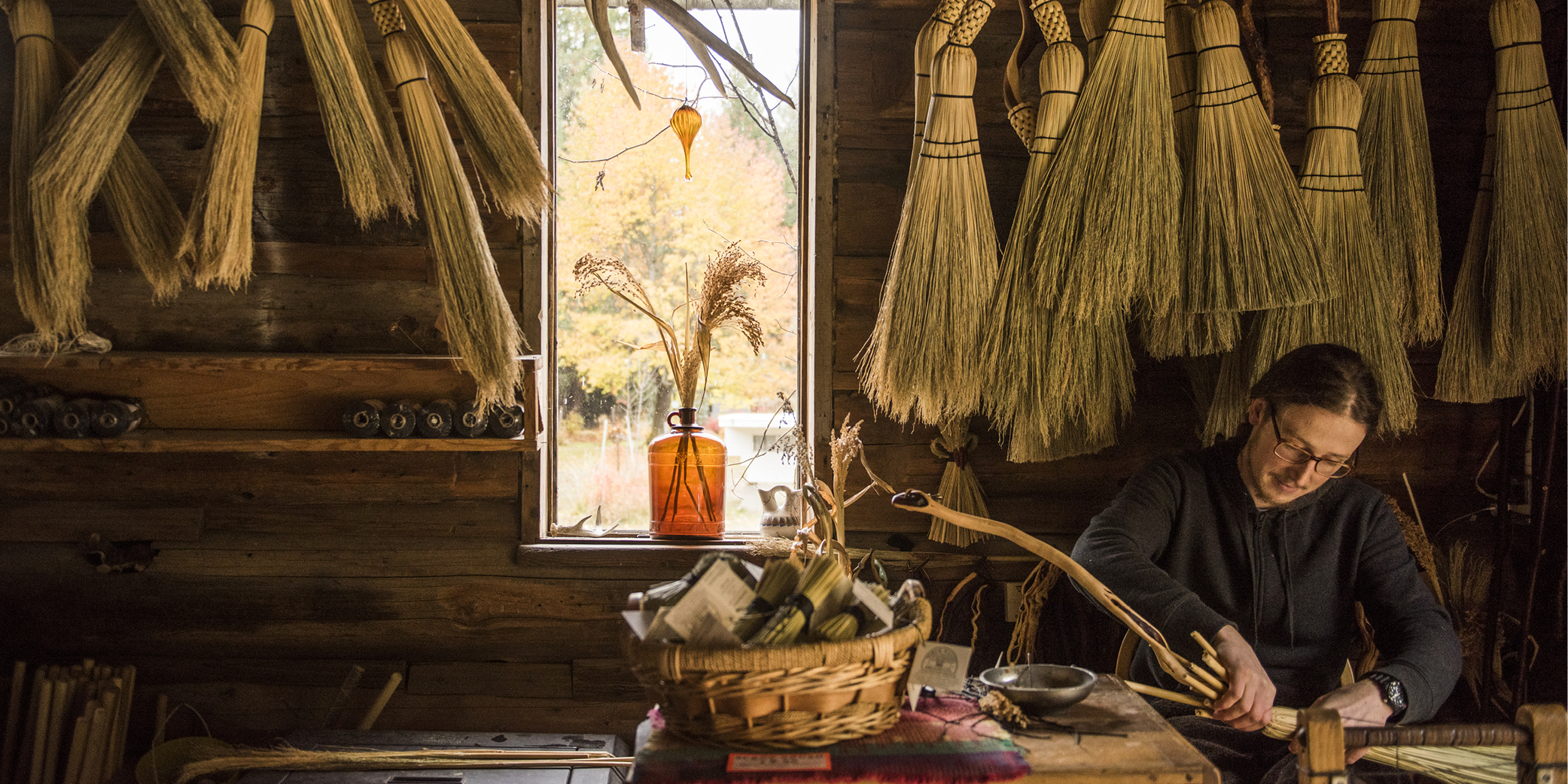 Luke Lewis crafting a beautiful wooden broom.