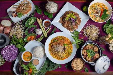 A table with a variety of colourful food at Busaba Thai Cafe in Nelson, BC