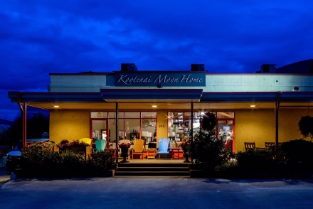 The Kootenai Moon Furniture store lit up at night