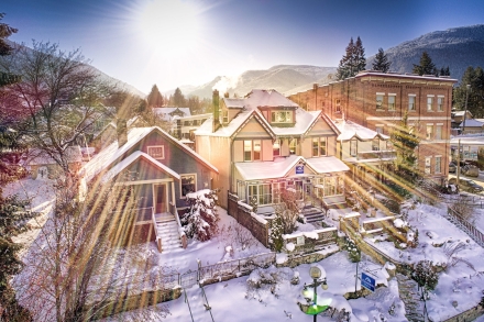 an aerial view of the cloudside motel with sun rays shining through