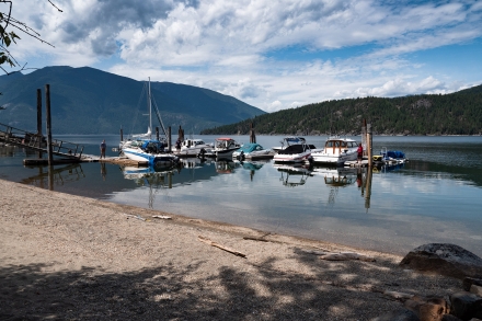 View of the marina with mountains in the background at The Lakeview in Gray Creek near Crawford Bay, BC