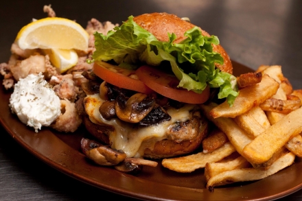 a burger with all of the fixings and fries on the side from Main Street Diner