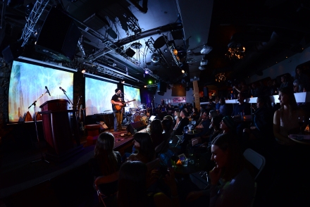 A musician playing a guitar in Spiritbar during the Kootenay Music awards