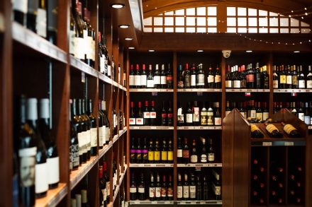 Wine bottles line the shelves at the Grand Liquor Merchant