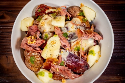 Bowl of poutine, with cheese curds, duck over potatoes from Beauties, in Nelson.