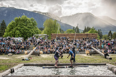Two log rollers competing against each other at Kaslo Logger Sports. 