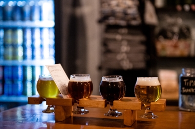 A flight of four beers on the counter of Nelson Brewing Company.