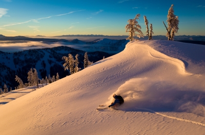 A skiier at Whitewater Ski Resort during golden hour