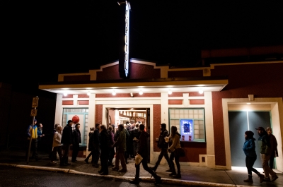 A group of people walking into the Capitol theatre in Nelson, BC