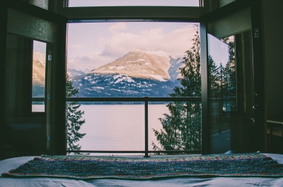 View of snowy mountains from inside accomodation.