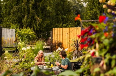 Two people dining on the Black Salt Cafe patio.