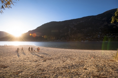 A group playing volley ball on the beach at Lakeside Park in Nelson, BC.