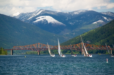 Sailboats on Kootenay Lake with the Big Orange Bridge in the background. 