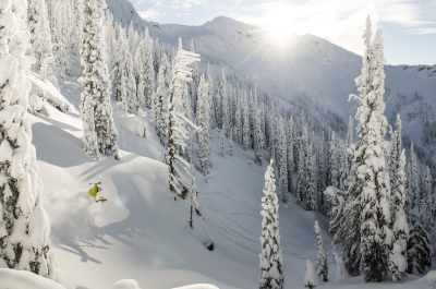 A skiier in the trees at Whitewater Ski Resort near Nelson, BC.