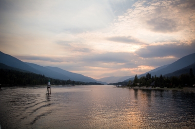 The sun starting to set on Kootenay Lake. View from the Kootenay Lake Ferry just after leaving the Balfour Ferry Terminal