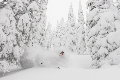 A skiier in deep powder at Whitewater Ski Resort near Nelson, BC.
