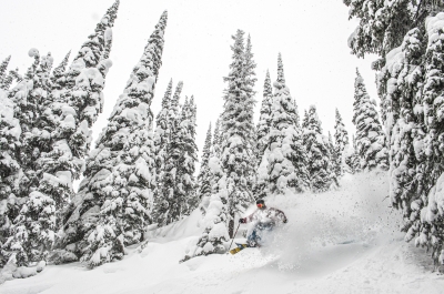 A skiier in deep powder at Whitewater Ski Resort near Nelson, BC.