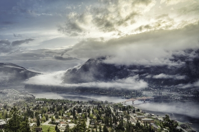 Aerial view of Nelson BC and Kootenay Lake with low hanging cloud.