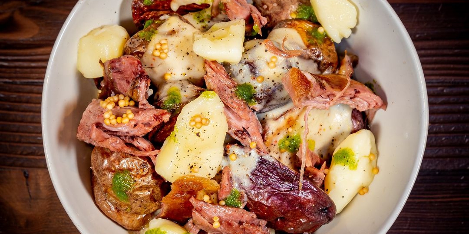 Bowl of poutine, with cheese curds, duck over potatoes from Beauties, in Nelson.