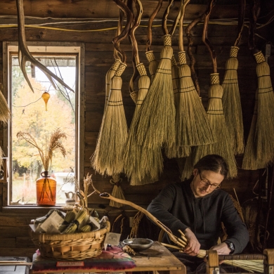 An artisans broom maker working in his Crawford Bay, BC studio.