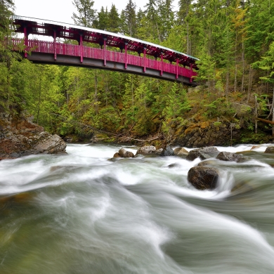 Kaslo River Trail bridge with water flowing below