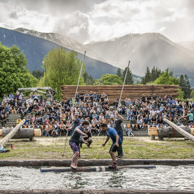 Two log rollers competing against each other at Kaslo Logger Sports. 