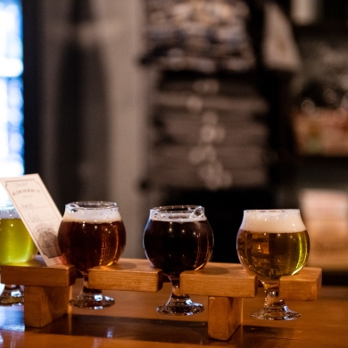 A flight of four beers on the counter of Nelson Brewing Company.
