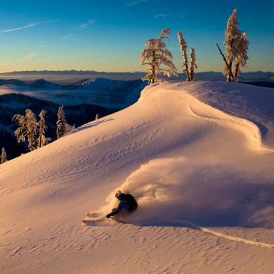 A skiier at Whitewater Ski Resort during golden hour