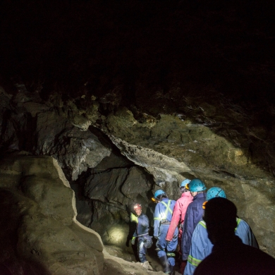 People walking in a cave at Cody Caves near Nelson BC