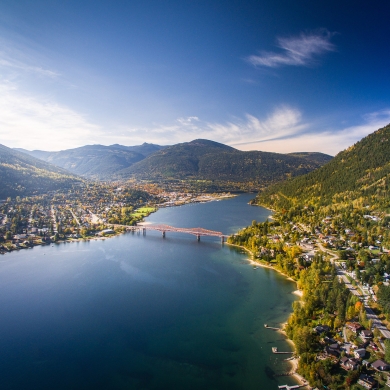 Aerial photo of Nelson, BC in the Fall, looking down the lake to Big Orange Bridge