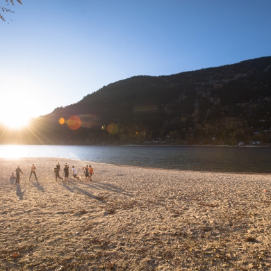 A group playing volley ball on the beach at Lakeside Park in Nelson, BC.