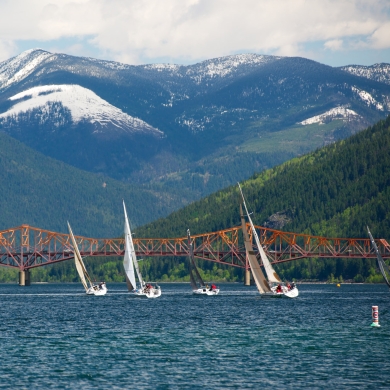 Sailboats on Kootenay Lake with the Big Orange Bridge in the background. 