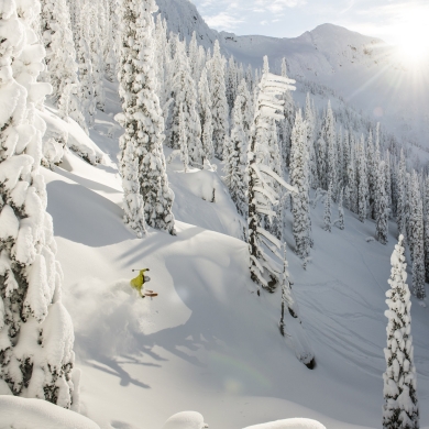 A skiier in the trees at Whitewater Ski Resort near Nelson, BC.