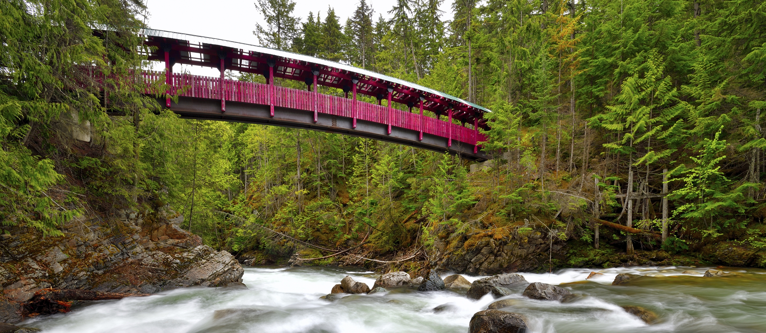 Kaslo River Trail bridge with water flowing below