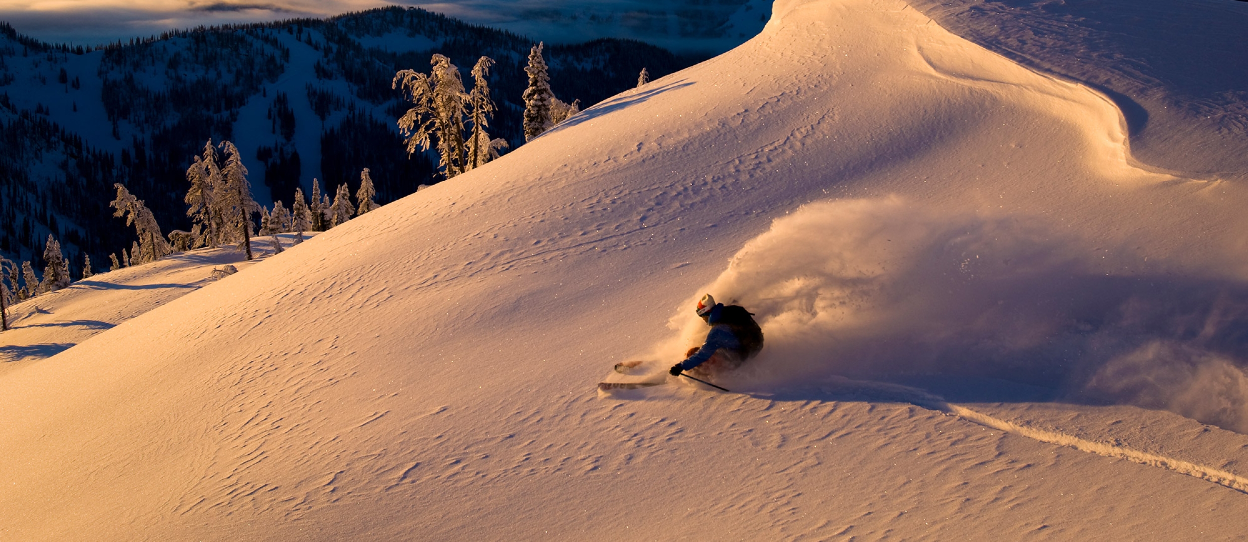 A skiier at Whitewater Ski Resort during golden hour