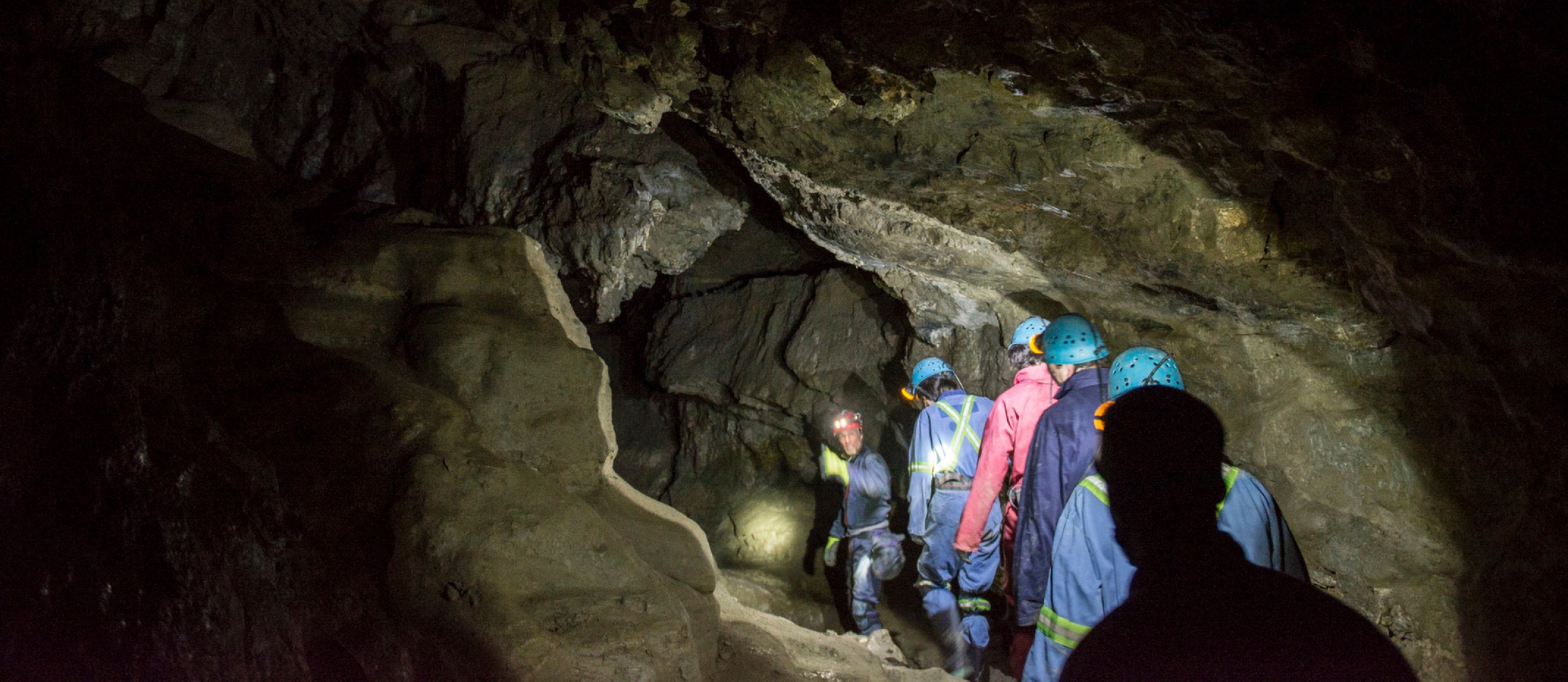 People walking in a cave at Cody Caves near Nelson BC