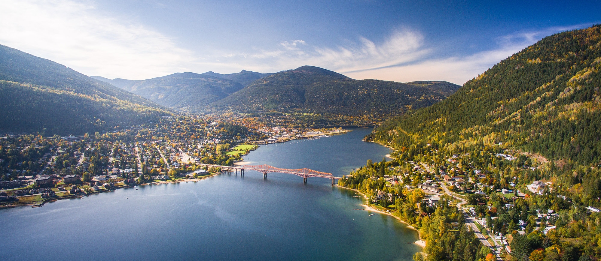 Aerial photo of Nelson, BC in the Fall, looking down the lake to Big Orange Bridge