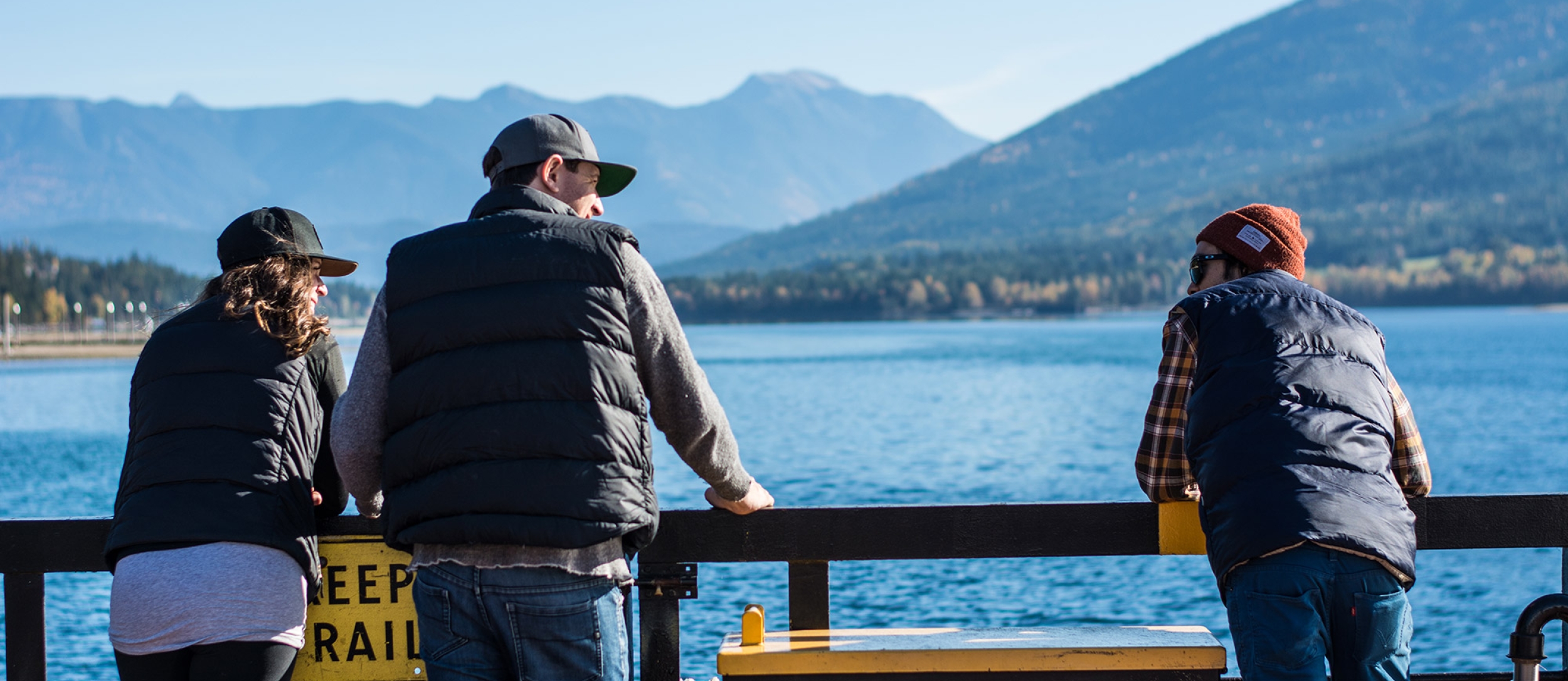 People talking while enjoying the view on one of Kootenay Lake's ferries.