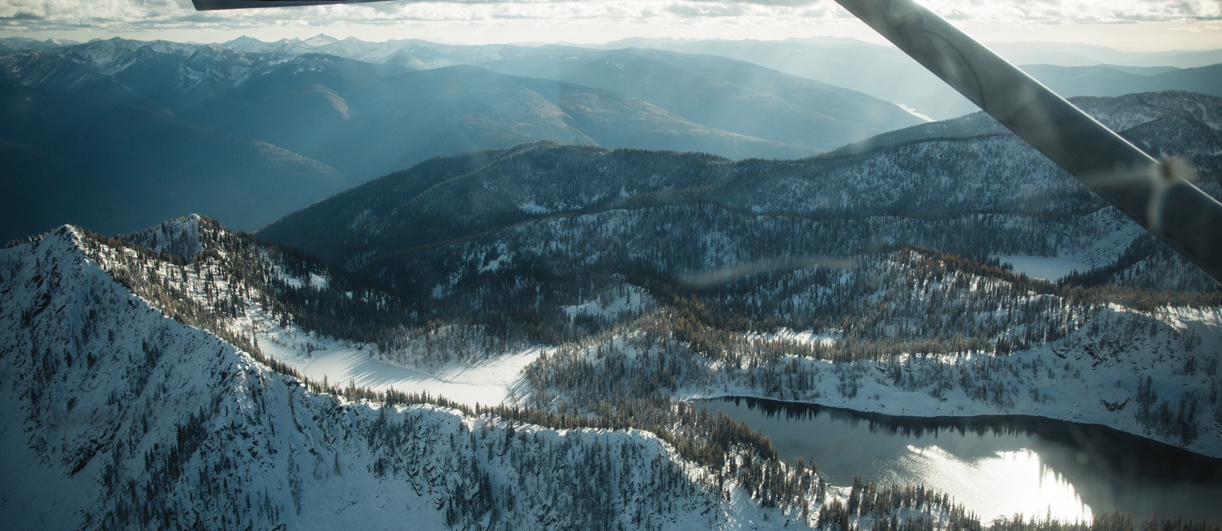 Looking out of an airplane window at Kokanee Glacier Provincial Park