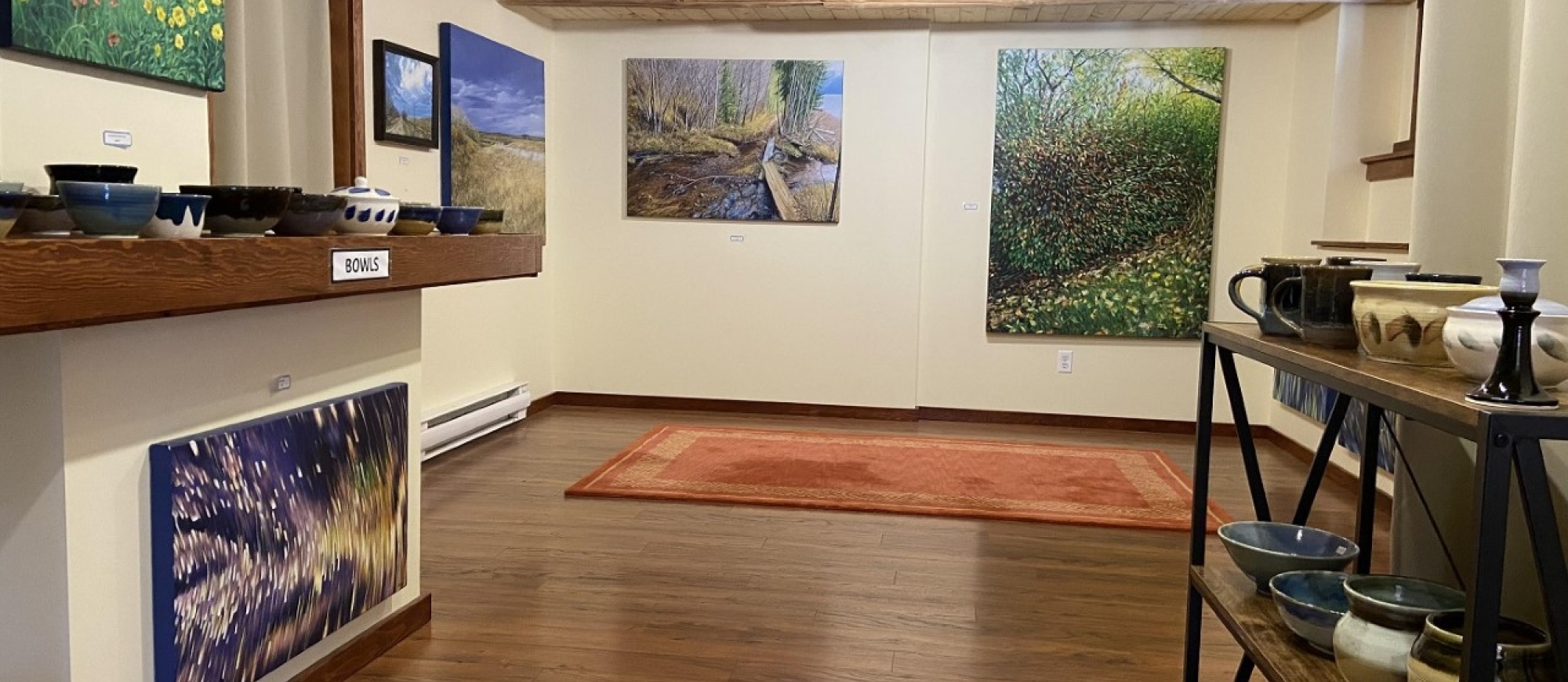 Inside of artist gallery with local paintings