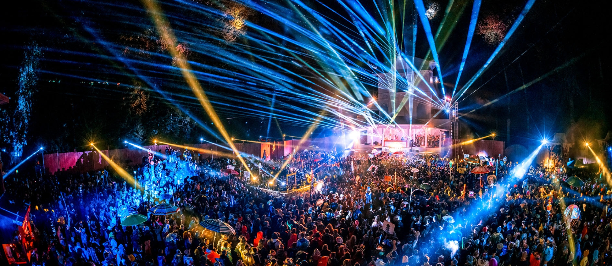 fans fill the dancefloor of the Pagoda Stage as it lights up with blue lazer lights at Shambhala Music Festival