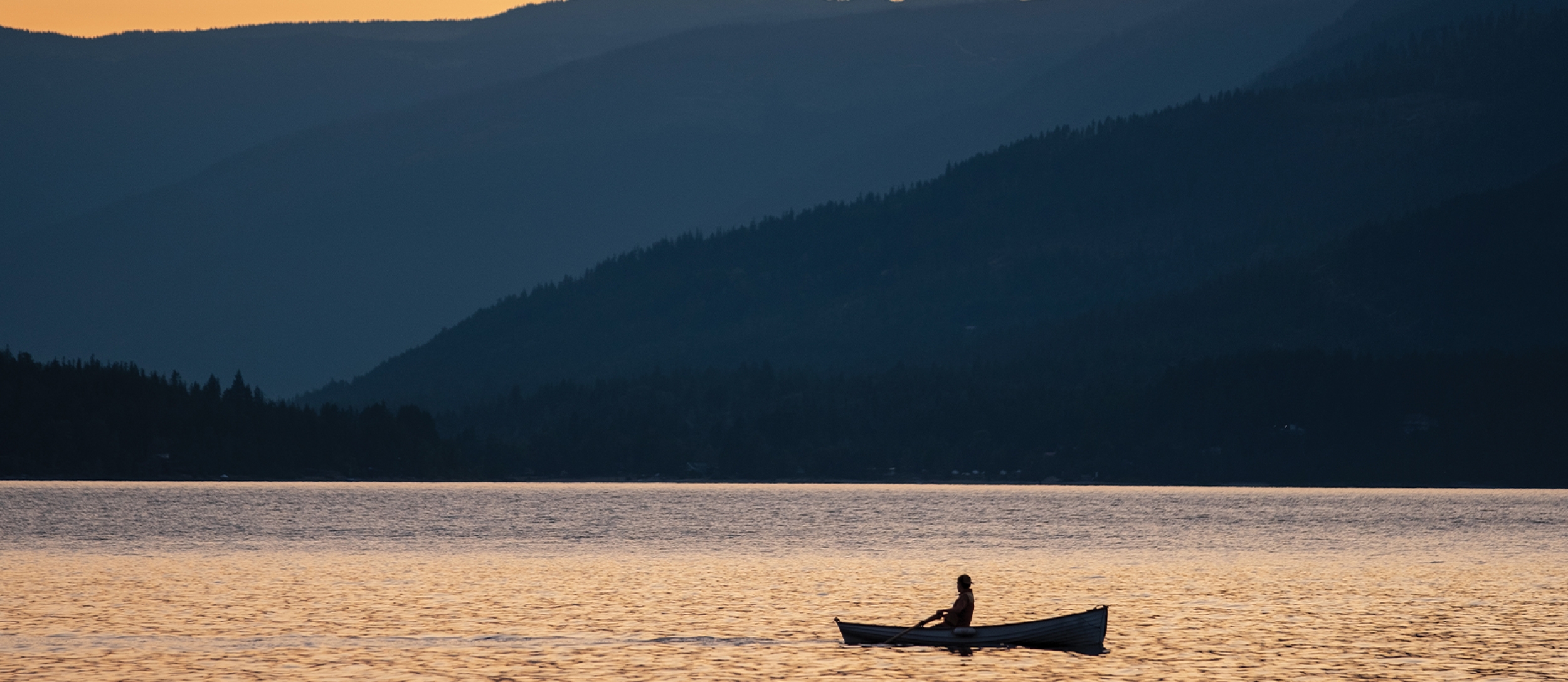 Person paddling in their canoe.