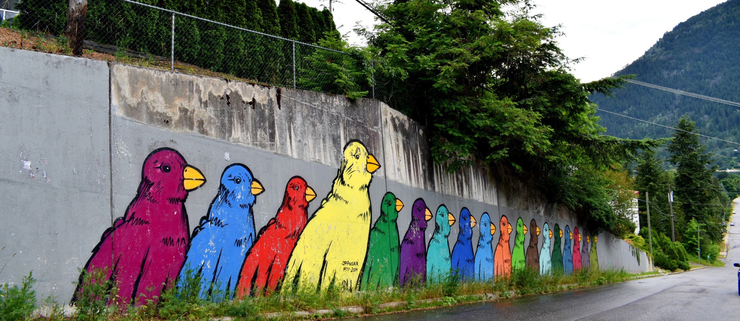 Tribute to JP Auclair, mural of brightly coloured birds